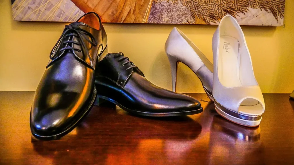 A pair of elegant low-heeled leather pumps on a clean neutral background.
