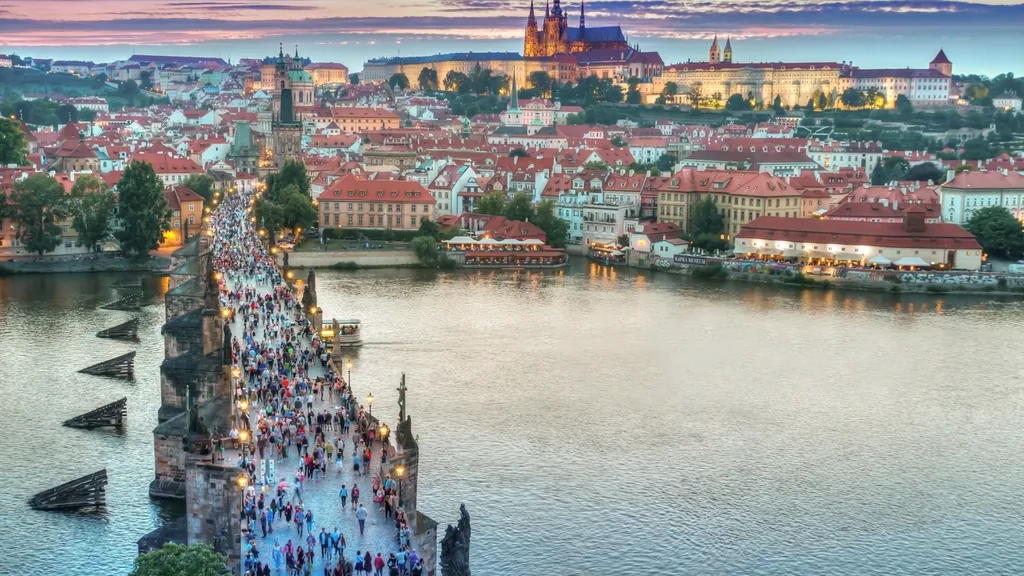 A panoramic view of Prague's old town with the Charles Bridge over the river.