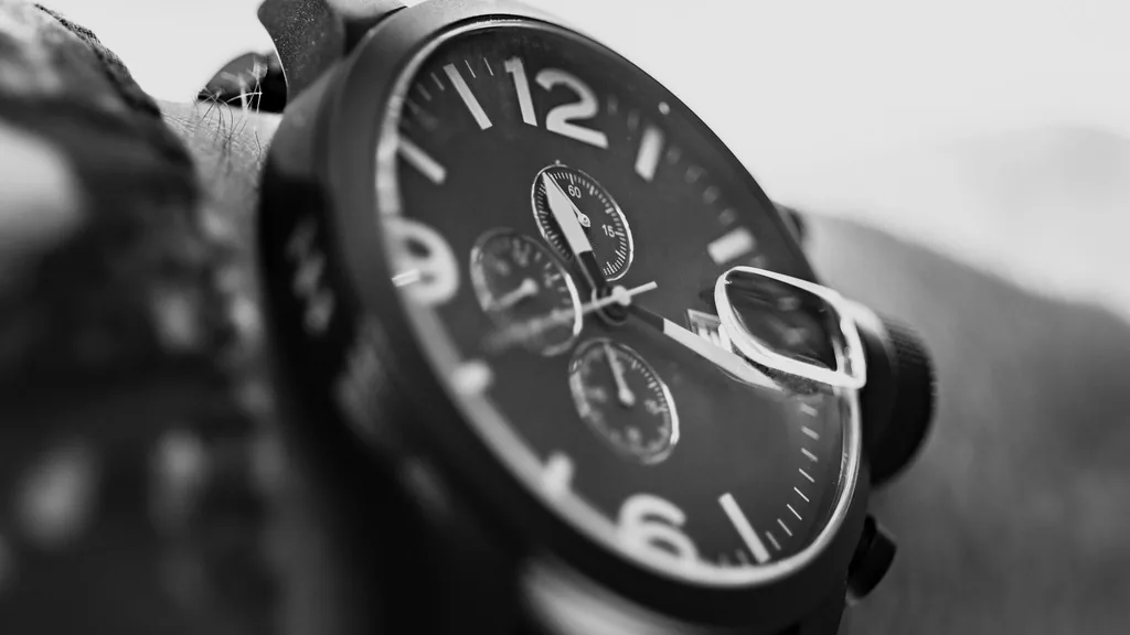 A close-up of a rugged mechanical diver's watch on a wrist.