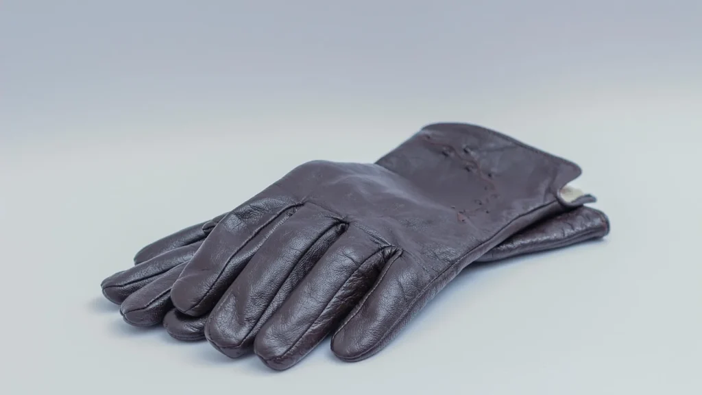 Elegant leather and wool gloves paired with a winter coat.